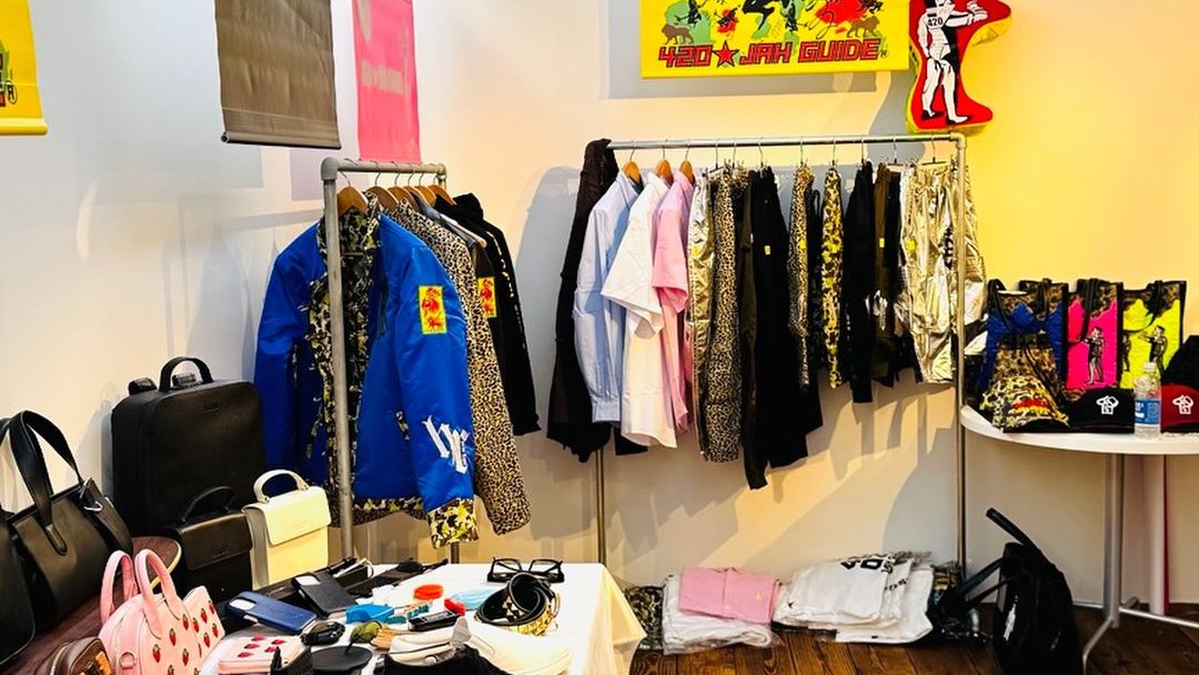 The Tokyo showroom — a rail of jackets and a table of samples